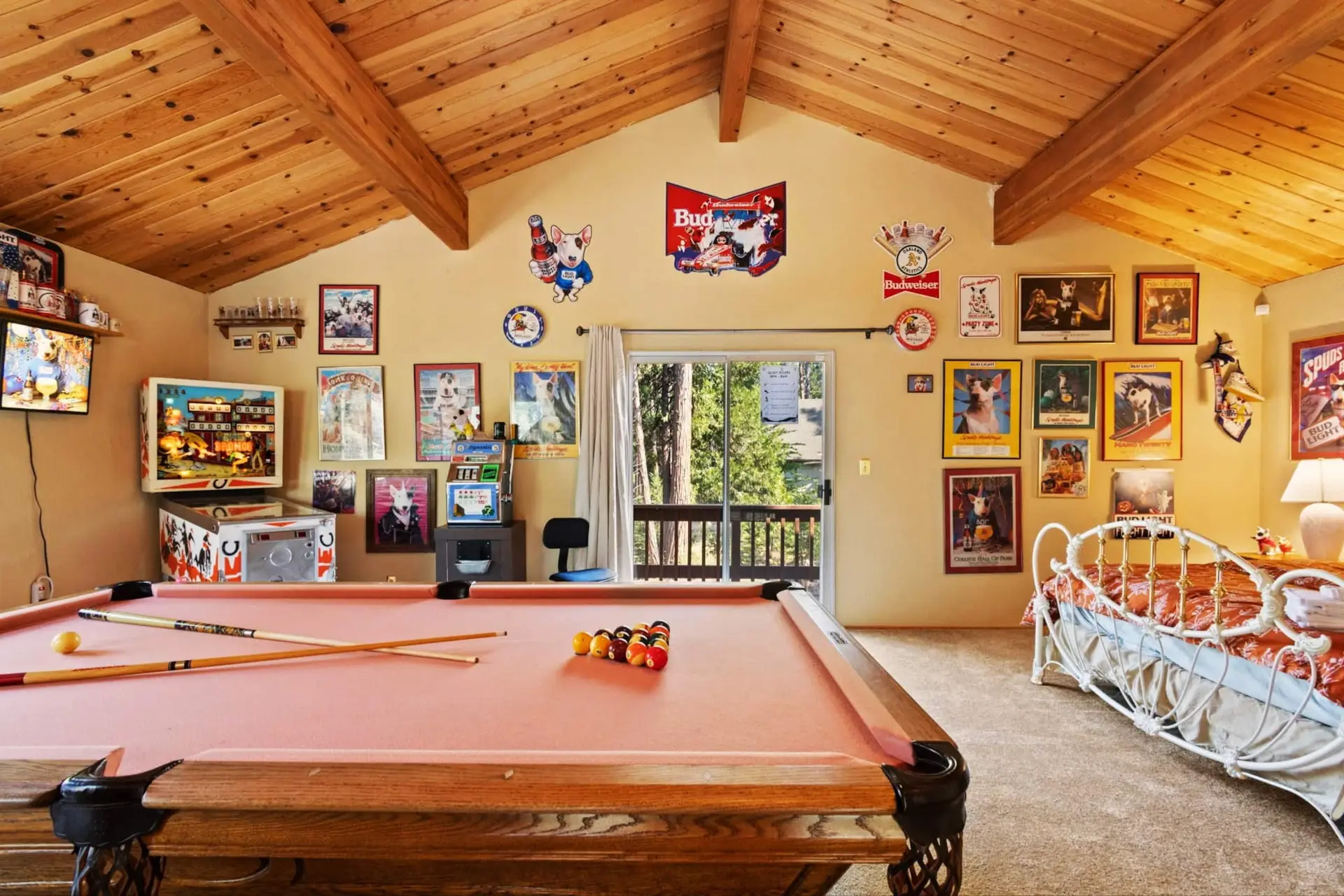 Game room with a full-size pool table and retro art, Knotty Pine Chalet