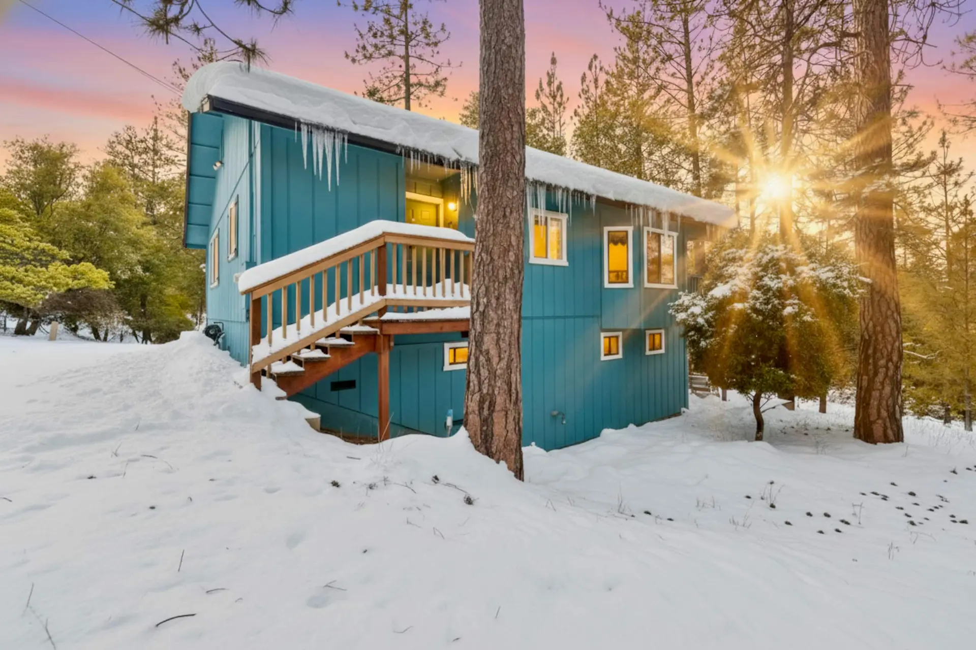 The blue cabin in snow at sunrise among the pines, Pine Mountain Lake Cabin